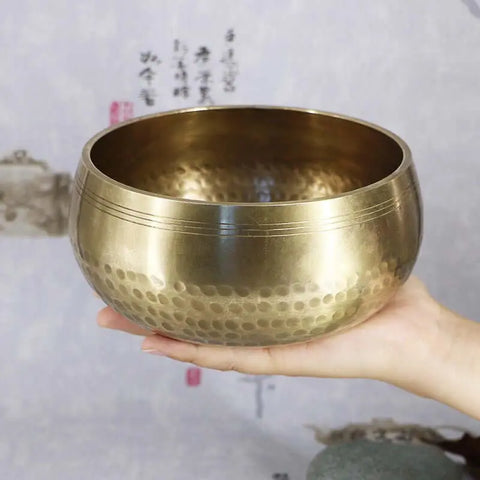 Rim-playing a Himalayan singing bowl — sustained tone — Auckland home practice